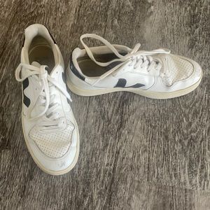 Worn white and black Veja sneakers